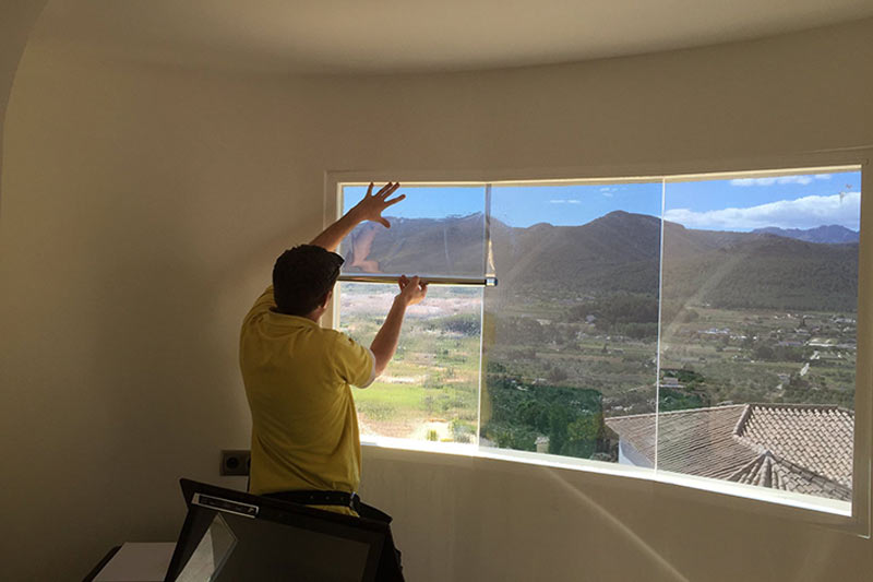 Solar Guard staff installing window film